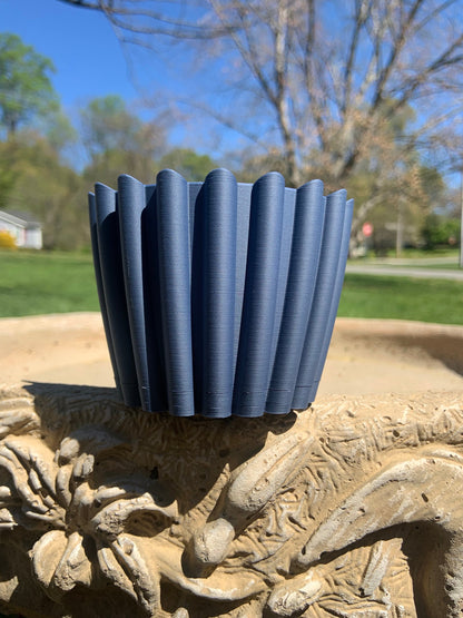 Planter pot navy blue with hidden drainage tray.