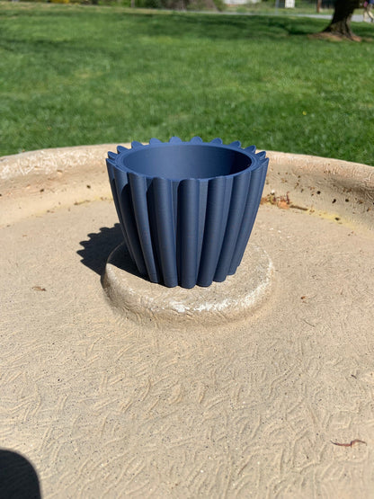 Planter pot navy blue with hidden drainage tray.